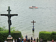 Gugel Manner visit ceremony to celebrate 130 years of the Death of King Ludwig II at Votiv Church in small electric boat.